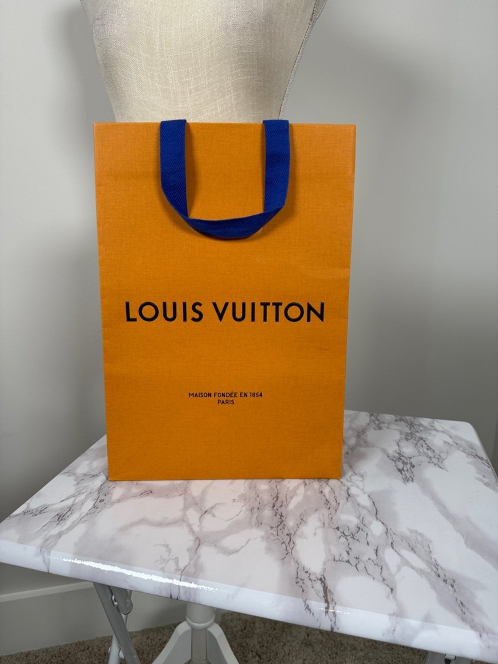 Authentic Louis Vuitton Orange Shopping Bag with Blue Handles